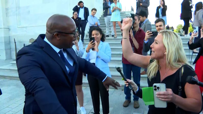 See Reps. Marjorie Taylor Greene and Jamaal Bowman debate Rep. George Santos on Capitol steps