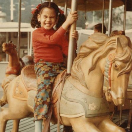 Harris rides a carousel in this old photo <a href=