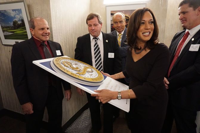 Harris receives a gift from supporters in January 2015 after she announced plans to run for the US Senate.